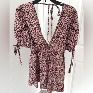 NWT Front wrap romper with shorts and bell sleeves with ties.